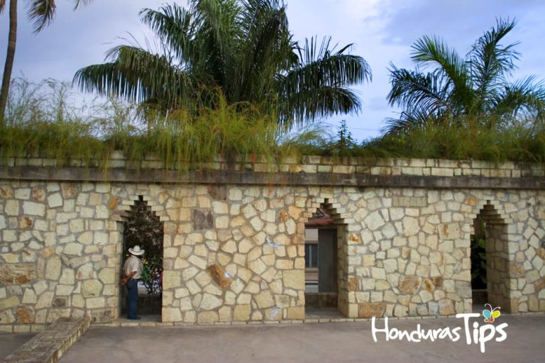"A local resident stands in a stone wall doorway in the town of Copan Ruins just outside the Mayan ruins of Copan, Honduras"